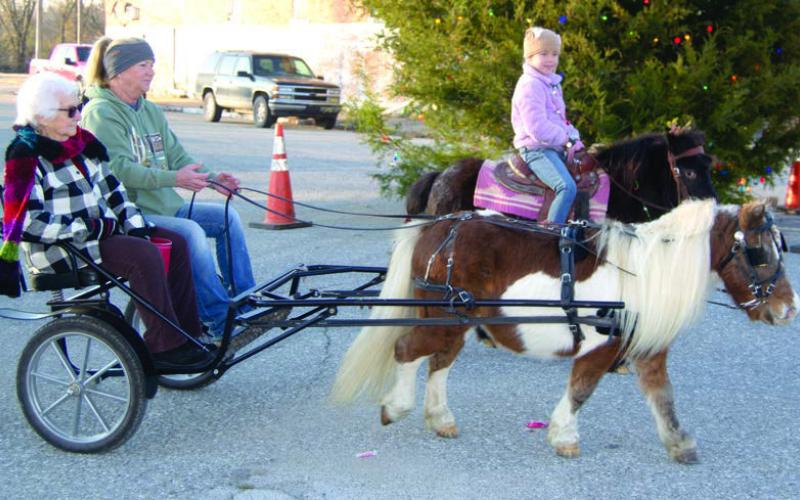 The parade in Scammon Sunday, December 1 was the first of the Cherokee County parade season. Among the entries travelling along the parade route was these miniature horses. Caroline Scammon was riding alongside the buggy carrying Peggy Lacoste.