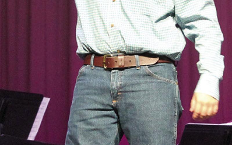 At right, who doesn’t love a good television western? Parker Neely was getting ready for a gunfight in his skit during the Titan Jazz Band presentation of “Channel Surfing.”