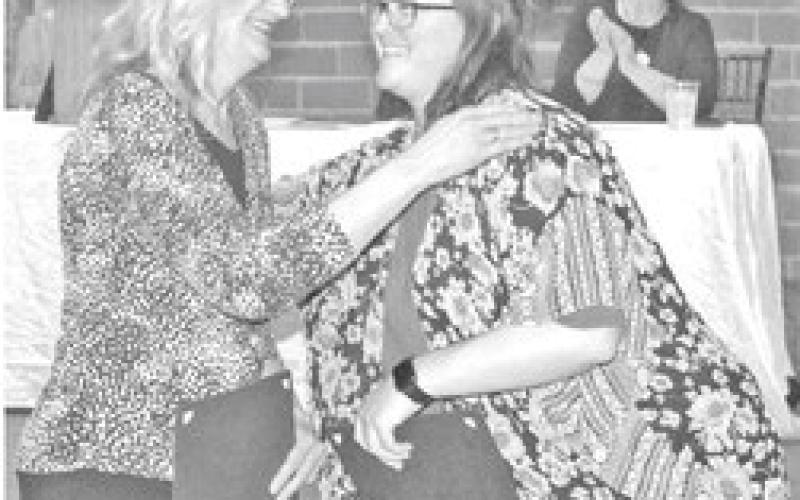Previous Top Titan nominees Susan Wells and Mattea Cupp. Wells was named the winner.