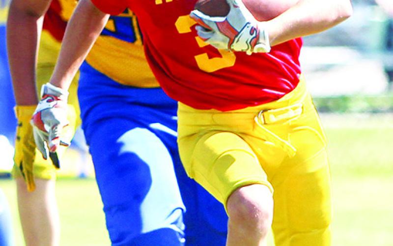 Cam Carter was a workhorse for the Titan Fifth and Sixth Grade Team in their 30-6 rout of the Parsons Vikings, Saturday at Titan Stadium. Photo by Kristin Sharp.