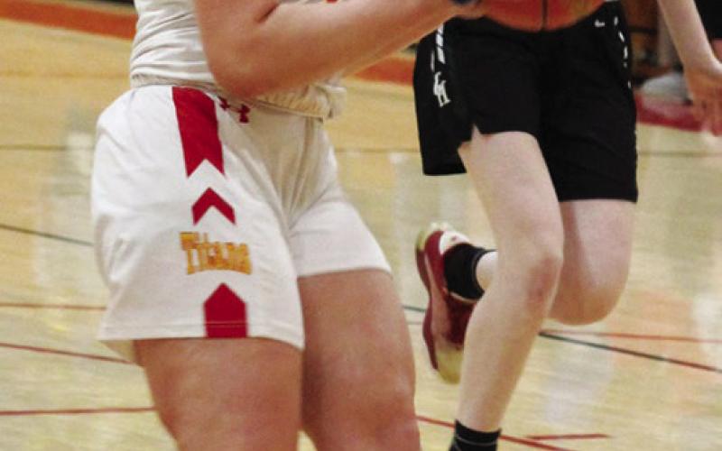 Graci Major, Lady Titan Senior, goes in for a layup in Friday’s MOKAN Tournament win over College Heights, 59-40, at the highs school gymnasium.