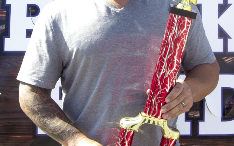 Cookin-N-Khakis represented by Nate Long was the overall champion in the Columbus Day Police, Pork and Pride barbecue competition. Long placed first in Chicken, Ribs and Pork.