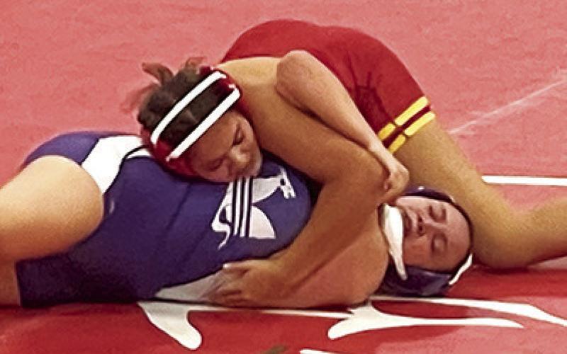 Lady Titan Senior, Brooklyn Lima, placed fifth in the Kan/Okla Tournament, Friday, at Caney Valley. She won this match by fall over Rachel Miller, Pittsburg, on her way to earning a spot on the podium. Brooklyn is now 2-3 on the young season. Courtesy Photo.