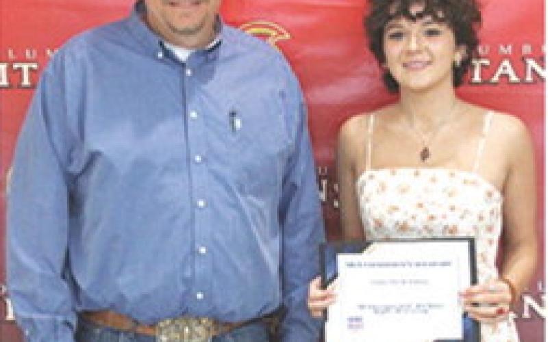 Emma Duling received a FFA Alumni, the Willie Benedict Memorial, and the Raymond Mitchell Scholarships in the amount of $500 each from CUHS Ag Instructor, KC Youngblood, at the Senior Assembly May 16, in the high school gymnasium.