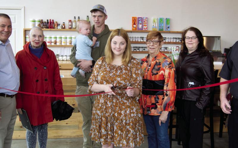 Community welcomes new business with ribbon cutting