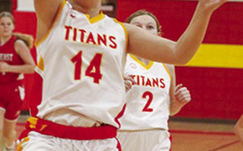 Columbus Lady Titan, Annabell Baker, drives in for a layup in the Saturday, Jamboree, hosted at the Columbus Unified High School Gym. Laklynn Carter trails for the rebound.