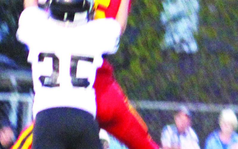 Titan Freshman, Kooper Saiz, comes down with a catch against the Frontenac Junior Varsity, Monday, at Titan Stadium. The Raiders took the win, 20-0.