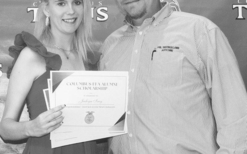 Jadeyn Ivey received multiple awards from Ag Instructior K.C. Youngblood during the Senior Assembly, May 19 at the CUHS Gym. Jadeyn received a $250 Columbus FFA Alumni Scholarship, a $500 Mitchel Memorial Scholarship, and a $500 Willy Benedict Memorial Scholarship