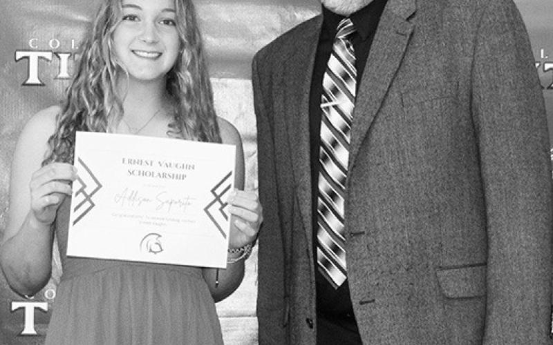 Columbus Unified High School Math Instructor, Ernie Vaughn presented Addison Saporito, a $250 Scholarship in his name during the May 19, Senior Assembly at the CUHS Gymnasium.