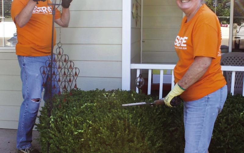 Don Willey and Kathy Shouse were trimming bushes during Connecting Point Church’s Big Serve Day.