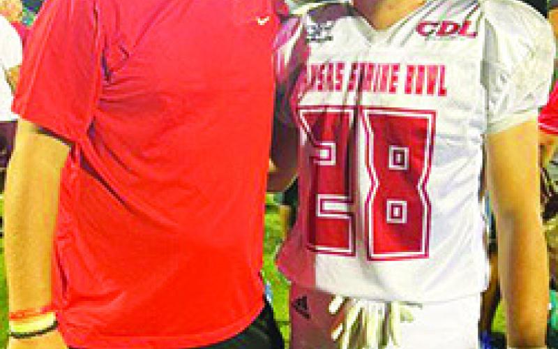 Titan Football Assistant Coach, Matt Crain, made the trip to Hays to watch his former player, Landin Midgett, play in the 50th Annual Kansas Shrine Bowl All-Star Game, Saturday, at Lewis Field Stadium. Courtesy Photo.