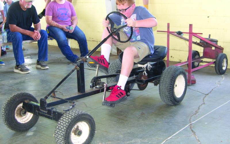 During the annual Pedal Tractor Pull, younger children get to try their hand at a smaller tractor, while older youngsters try their hand at this one. Winners in each division have the opportunity to compete at the Kansas State Fair.