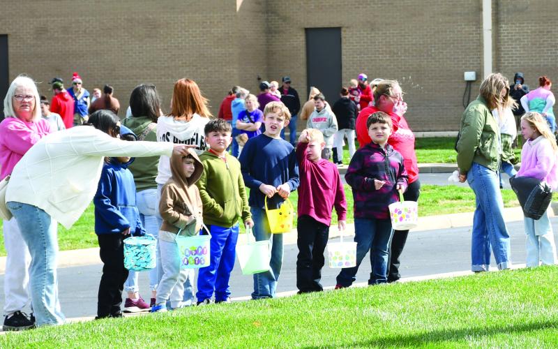 Each year the Baxter Springs Kiwanis Club Easter egg hunt draws a large crowd. Many youngsters waited for the race to the eggs to begin. The hunt was held Saturday at Baxter Springs High School.