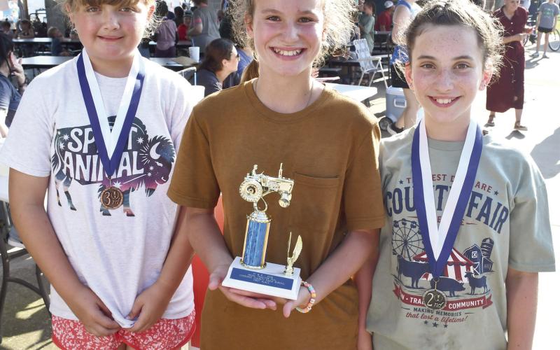 Winners in the 11 year old division of the Pedal Tractor Pull were third place Emma Rios 7’2”. First Place Remy Schuberger, 27’10” and second place Demi Pritchard, 16’6”.
