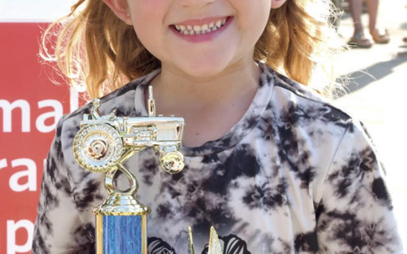 Out of town entrant Kinsleigh Lyman was the lone contestant in the 6 year old division of the Pedal Tractor Pull. Lyman, an Iowa native, pulled a distance of 28 feet.