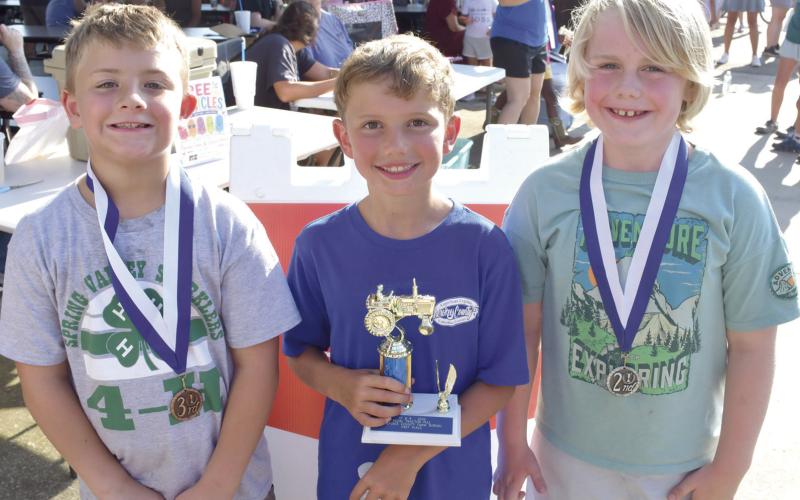 In the 8 year old division of the annual Pedal Tractor Pull, third place went to Jhett Davis with 29’5”. First place went to Hollis Haverkamp, 31’5”. Second place wen to Brooks Barcus with 29’7”.