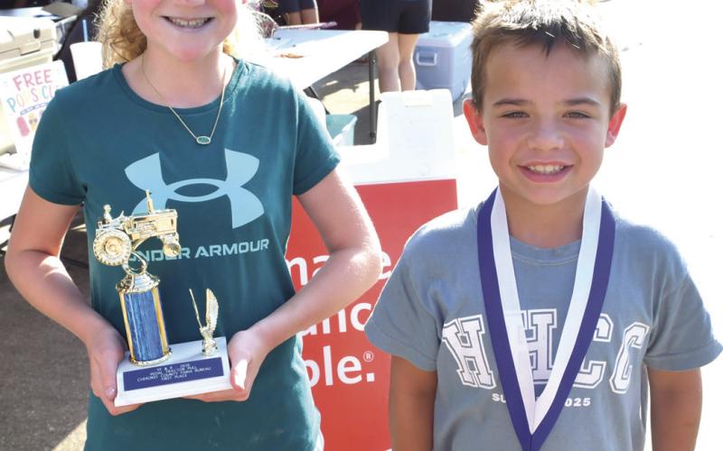 Nine year old Pedal Tractor Pull winners were Adley Hess, first place, 28’5” and Josh Lacen second place with 18’8”.