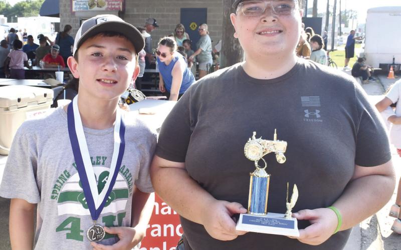 In the 12 year old division of the annual Pedal Tractor Pull, Hunter Davis placed second with a 31’5” pull. Ryker Saporito placed first with 32’6”.