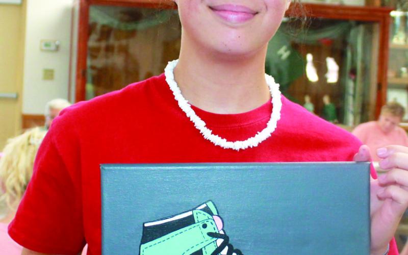 Trinity Adoremos, Glittering Stones, entered her work in the Visual Arts and Crafts classes during the Cherokee County Fair. She received three purple ribbons and a blue ribbon for her efforts.