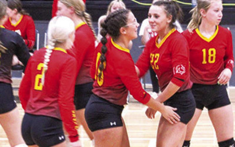 Katy Mooney and Katie Simpson celebrate after a point at the Frontenac Tournament recently.
