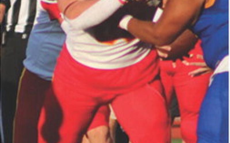 Lineman, Kash Smith, Titan All-State Sophomore, fends off a Parsons Lineman, during the four-team Jamboree Scrimmage in Girard, Friday.