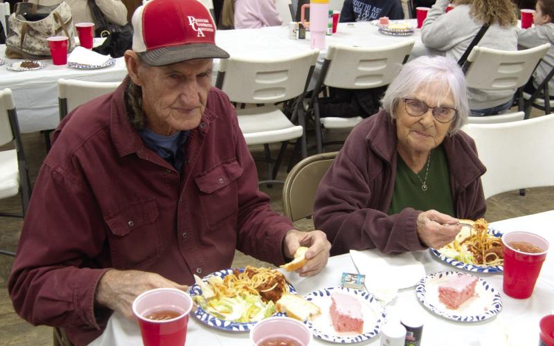 Attending the benefit for Jon Tavernaro as he struggles with Cancer were Marvin Eaton and Mary Parton. The spaghetti dinner drew a large crowd and visitors showed interest in the silent auction items.