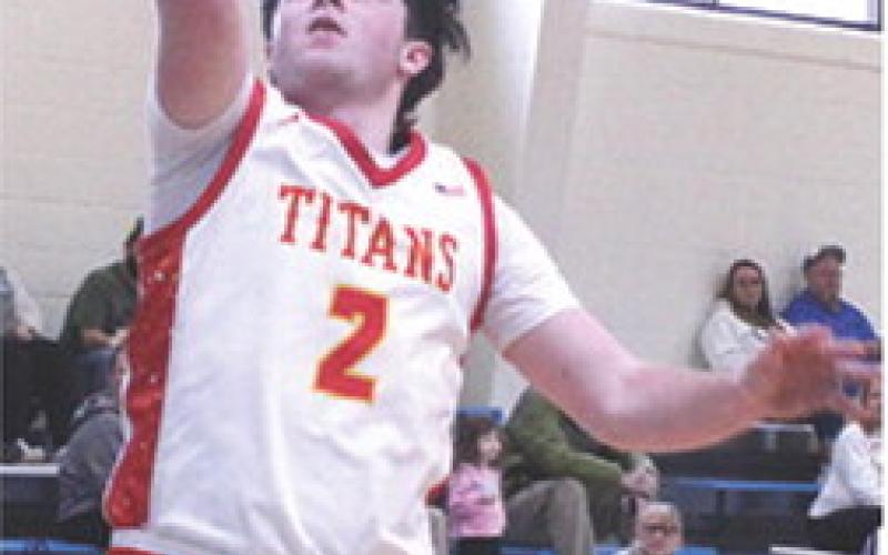 Titan Senior, Jett Tanner, scored on back-to-back steals and layups in the Columbus, Lancer Classic, loss to Commerce, Okla., 50-65, Saturday, at Southeast High School. Jett led the team in scoring with 14 points.