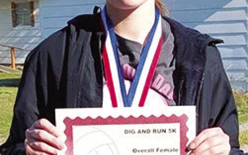 Katelyn Draeger won first place in the Lady Titan Volleyball Fundraiser 5K Run, April 20. Katelyn took first in the 14-18 age group and was the overall female racer with a time of 30.43 minutes. Courtesy photo.