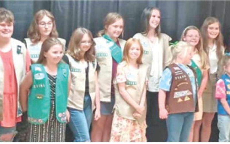 In September 2024, the Cherokee County Girl Scouts held a Bridging and Awards banquet honoring both girl scouts and adult volunteers. Girls Scouts from five Cherokee County Troops bridged up to the next level in Girl Scouts. Izabel Manus from Troop 70363 (third from left) received her Silver Award for her project of building a fire pit area at the Columbus Scout House. Courtesy photo.