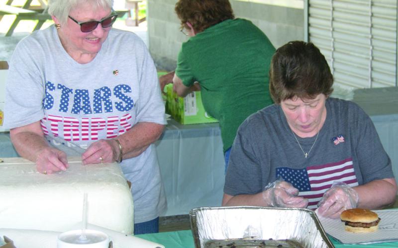 Linda Garrison and Linda Griffitt were wrapping burgers for the recent veterans and first responder appreciation lunch.