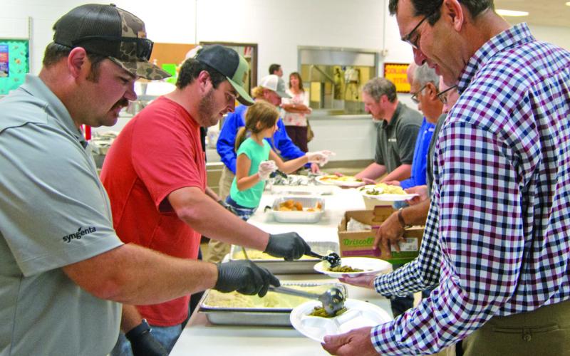 Farm Bureau recently held their annual dinner and meeting at Columbus High School. Attendees dined on chicken and noodles before the meeting began.