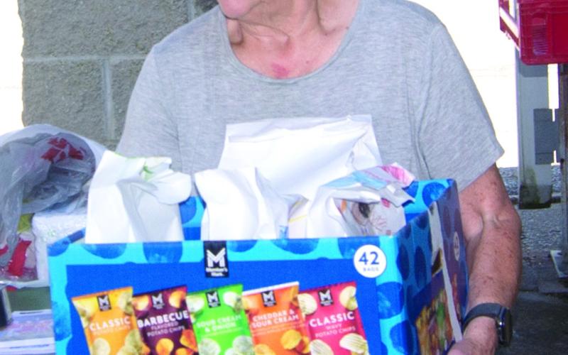 Mary Torchia was busy keeping the meals moving to their recipients at the veterans and first responder lunch.