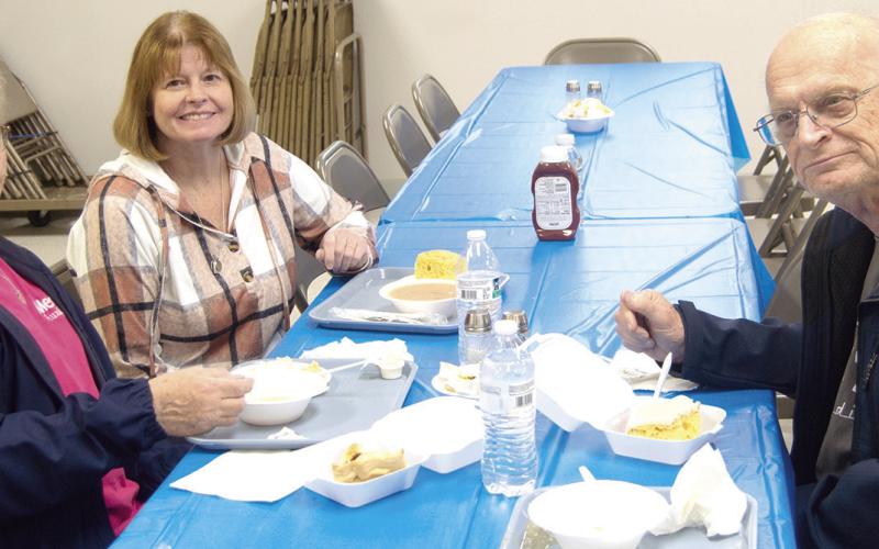 Clara White, Ralph White, and Regina Jameson enjoying lunch at the Columbus Lions Club Bean and Soup feed held March 5 at the St. Rose Parish Hall.