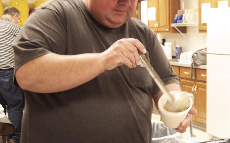 David Holmes was dipping beans at the Lions Club Bean and Soup feed held March 5 at the St. Rose Parish Hall.