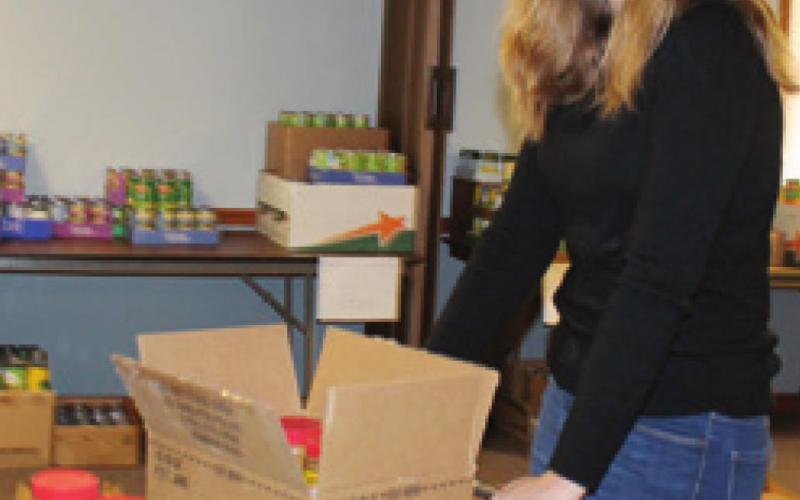 Community members, students assemble Thanksgiving food boxes