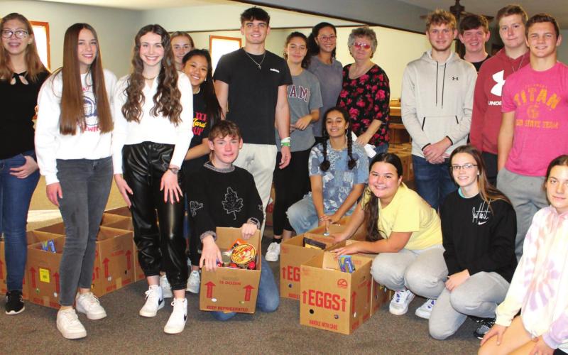 Community members, students assemble Thanksgiving food boxes