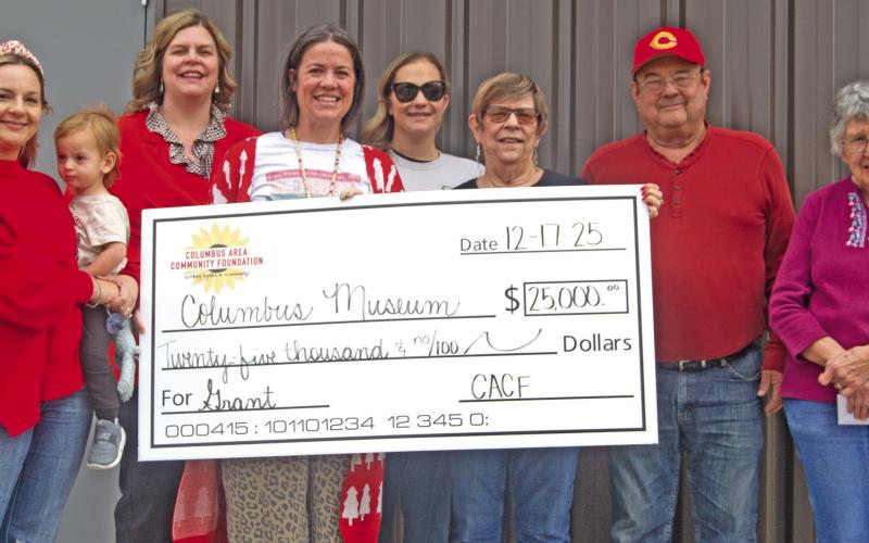 The Columbus Area Community Foundation recently presented a $25,000 dollar check to the Columbus museum for the new sports addition. Columbus Area Community Foundation members Christine Parsons, Jamie Robinson, Kelly Walters, and Maddy Foster were on hand as museum board members Anita Davolt, Ron Holmes and Ella Buzzard accepted the check. News Report photo by Shawn Churchill.