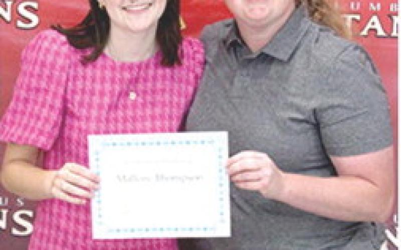Mallory Thompson received the Student Council Scholarship for $500 from Columbus High School StuCo Sponsor, Christine Lovell, during the 2025 Senior Assembly, May 16, at the CUHS Gymnasium.