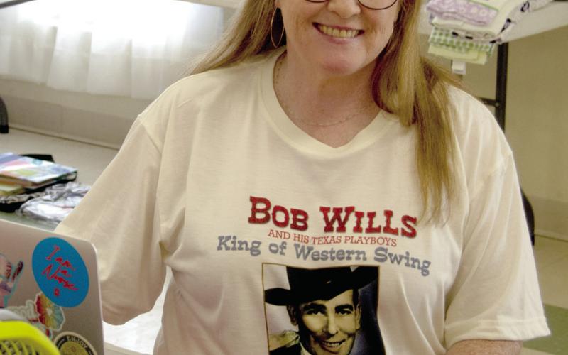 Pam Friemer called attention to the appearance of the Bob Wills, western swing band which had appeared recently at the Old Parita ballroom in nearby Carona. A concert she attended wearing the teeshirt she made.
