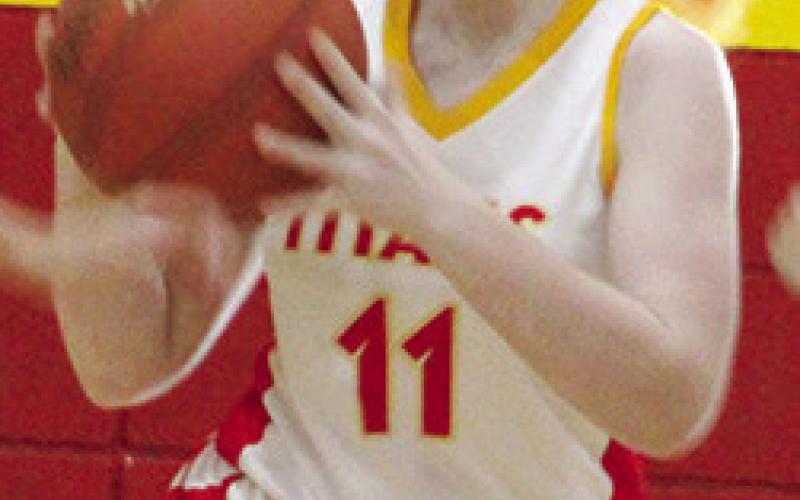 Mollie Sauerwein, Lady Titan Seventh Grader, looks to pass up-court after getting a steal in early season games at the CUHS Gymnasium.