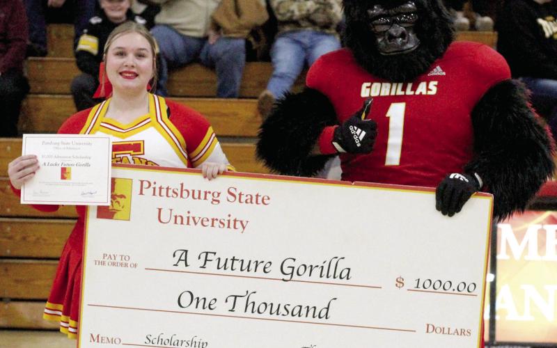 Pittsburg State University mascot Gus Gorilla recently traveled to Columbus to present Bre Reedy with a $1,000 academic scholarship.