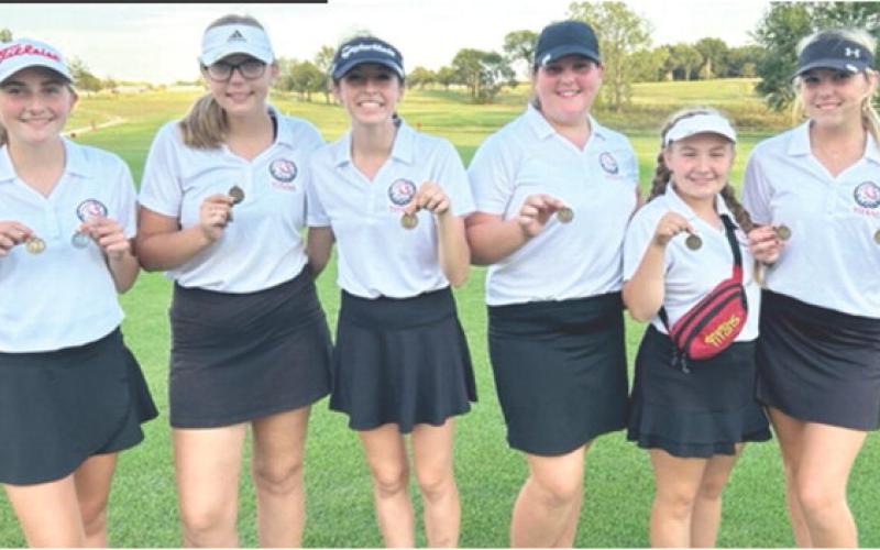 The Columbus Lady Titans and senior, Reese Grundy, earned first place at the Frontenac Invitational Golf Tournament in Erie, Tuesday. Junior, Mallory Thompson, tied Grundy in first place with 94 strokes but lost the tie breaker. The Lady Titans are nearing the end of regular season and preparing for post season tournament play. Team members are: Mallory Thompson, Anna Head, Natalie Wary, Jaiden Campbell, Amory Neely, and Reese Grundy. Courtesy Photo.