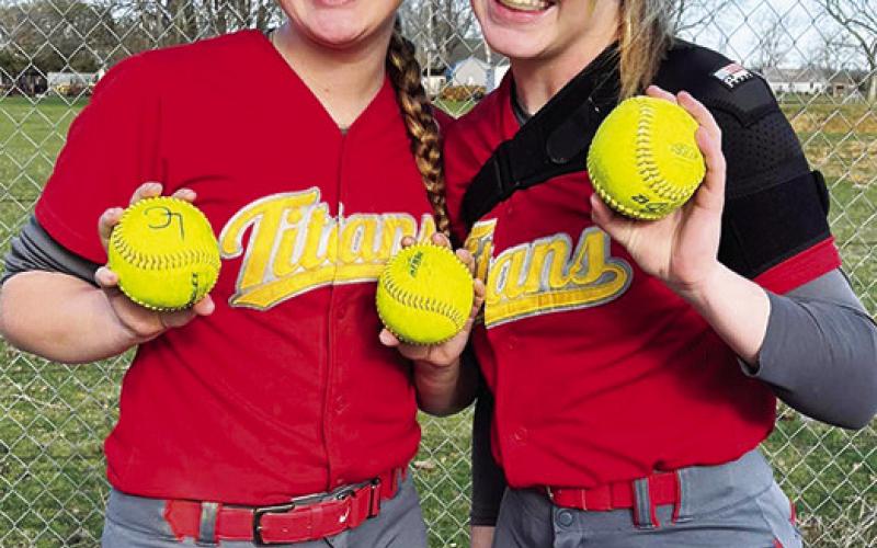 Lady Titan Juniors, Kaitlynn (KT) Lopp and Graci Major, collected their home run balls following their season opener on the road in Altamont. Lopp knocked two dingers over the fence and Major hit one over to help Columbus in their 17-1 win over the Lady Grizzlies, Monday. Courtesy Photo.