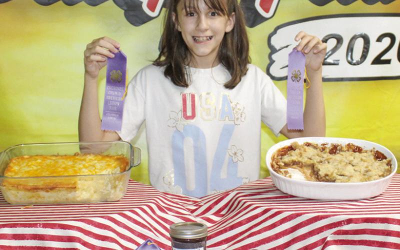 At the food show held Monday, July 6, Elena Clugston received purple ribbons for her efforts including a sample of her canning.