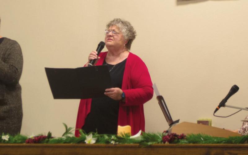 Camp Joy Ministries Pastor Linda Howard, First Methodist Pastor Lindsey Clarke and Camp Joy Ministries Pastor Cheri McCamey perform a stunning, three-part arrangement of “O Come, O Come, Emmanuel at Columbus Christian Center’s Cummunity Christmas Service on Sunday. All three women performed solo songs prior to joining for the trio during the service that evening. Photo by Jacob Spencer.