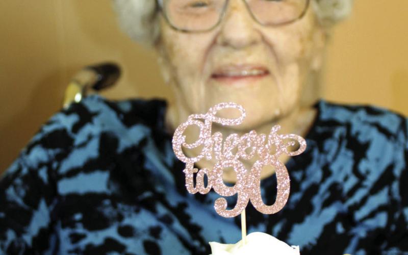 Shirley Grant shows one of the cupcakes from her 90th birthday party. Family and friends joined her in honor of the occasion.