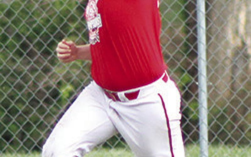 Titan Senior, Huck Hallam, makes a catch in the outfield during Thursday’s practice session at Bomber Field. Huck is one of two seniors new to the Titan Squad for the 2024 season.