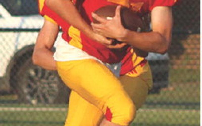 Titan Junior, Shade Schuberger, (left) had a long run inside the fiveyard line before being brought down by the Bulldog defender short of the goal line. A penalty and lost yardage kept Columbus out of the end zone during the Titan Junior Varsity loss to Galena, 0-24, Monday, at Titan Stadium.