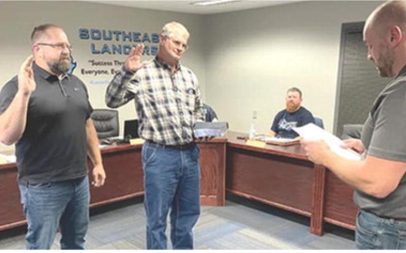 During a regularly scheduled school board meeting January 19, two newly elected Southeast USD 247 board members, Ray Huff and Darren Best, were administered the oath of office by Board Clerk, Dustin Wheeler. Courtesy photo.