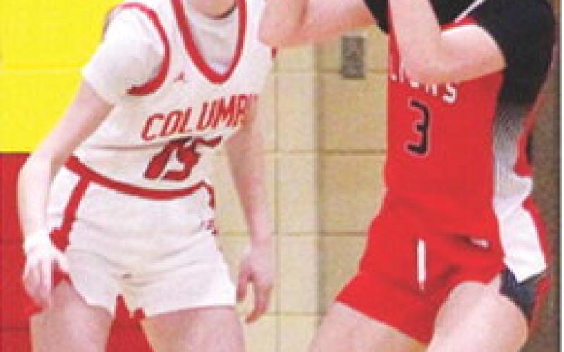 Junior, Kierstan Burggraf, scored eight of the Lady Lions, 12 points, in their Friday night loss to the Lady Titans, 12-45, in Columbus. Sophomore, Natalie Wary defends for the home team.